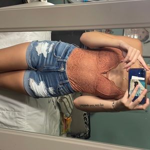 medium wash ripped shorts